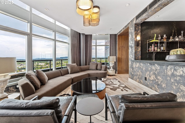 3601 S River Pkwy Unit 3101, Portland, OR 97239 - living area with healthy amount of natural light, wood finished floors, and expansive windows