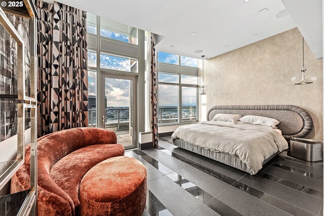 3601 S River Pkwy Unit 3101, Portland, OR 97239 - bedroom with access to exterior, a high ceiling, recessed lighting, and granite floors