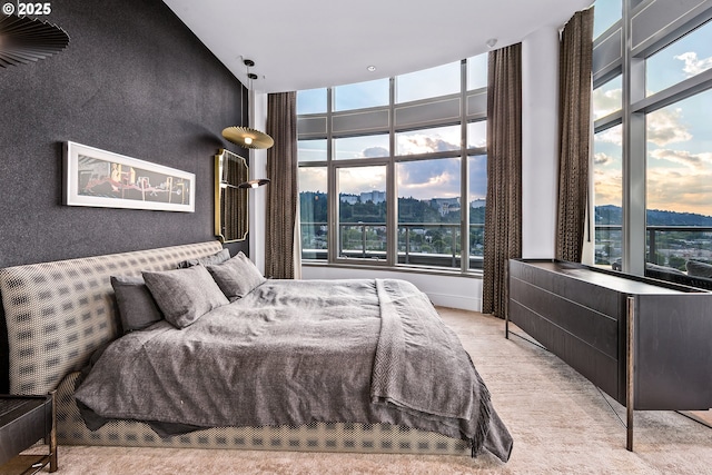 3601 S River Pkwy Unit 3101, Portland, OR 97239 - bedroom featuring a city view, a high ceiling, and light carpet