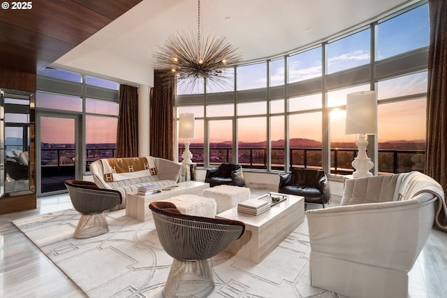3601 S River Pkwy Unit 3101, Portland, OR 97239 - living room featuring expansive windows, a chandelier, and a high ceiling
