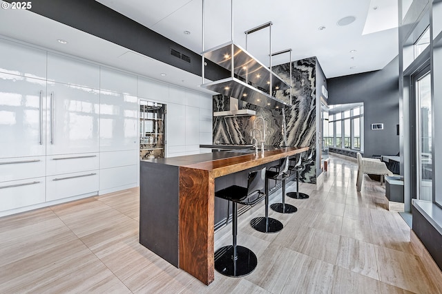 3601 S River Pkwy Unit 3101, Portland, OR 97239 - bar with light tile patterned floors and a sink