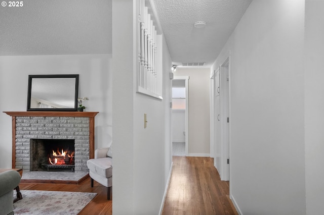 2110 NW Kings Blvd, Corvallis, OR 97330 - hall with a textured ceiling, dark wood-style flooring, and baseboards