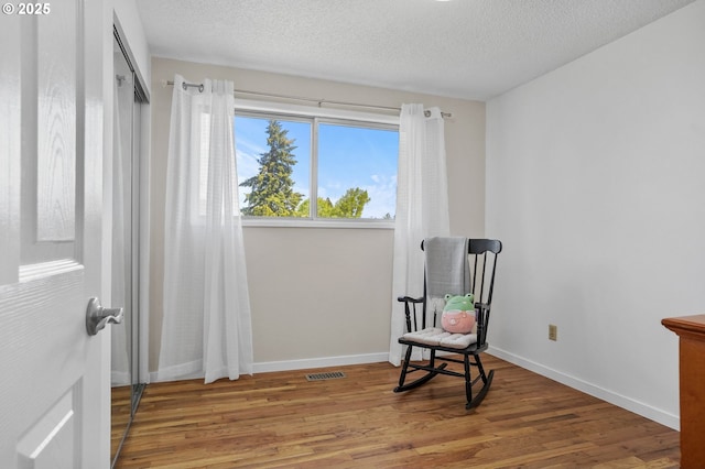 2110 NW Kings Blvd, Corvallis, OR 97330 - unfurnished room featuring wood finished floors, a textured ceiling, and baseboards
