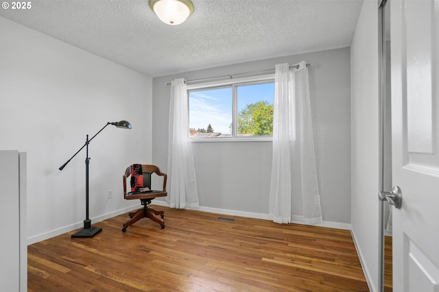 2110 NW Kings Blvd, Corvallis, OR 97330 - unfurnished room featuring wood finished floors, a textured ceiling, and baseboards