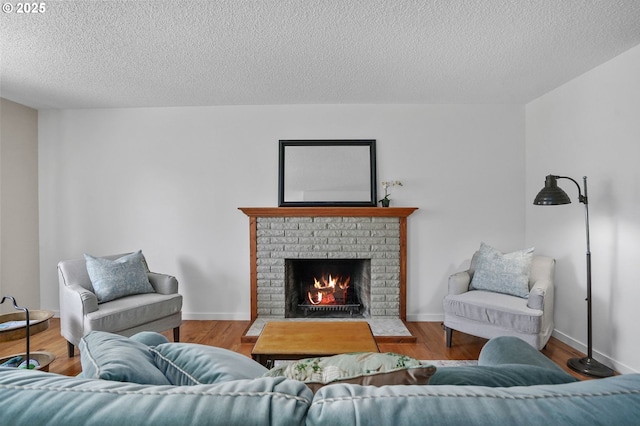 2110 NW Kings Blvd, Corvallis, OR 97330 - living area with a fireplace, a textured ceiling, and wood finished floors