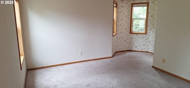 3890 Spruce St, Florence, OR 97439 - carpeted spare room featuring baseboards and wallpapered walls