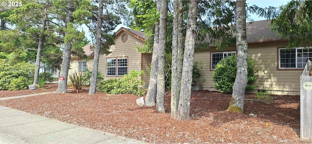 3890 Spruce St, Florence, OR 97439 - view of property exterior featuring roof with shingles and crawl space