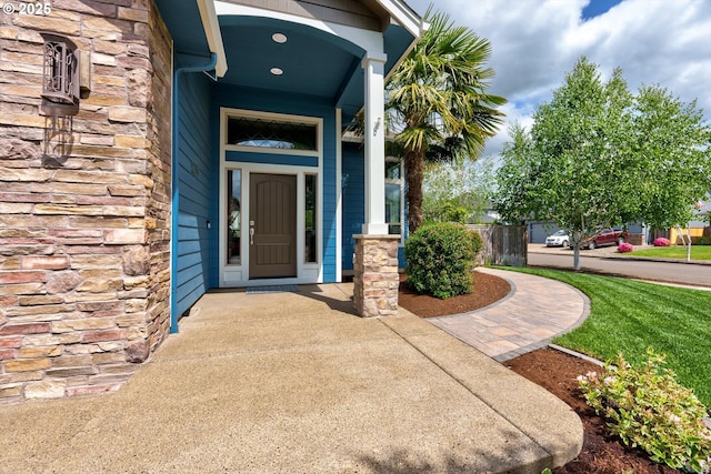 entrance to property featuring stone siding