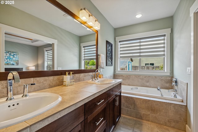 full bath featuring tile patterned flooring, a bath, and double vanity