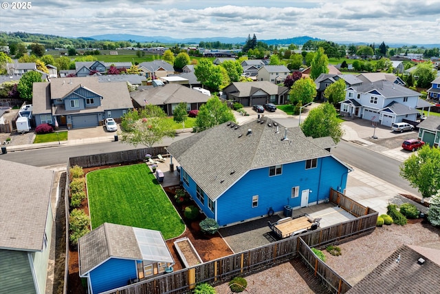 aerial perspective of suburban area featuring a mountainous background