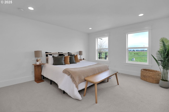 carpeted bedroom featuring recessed lighting and baseboards