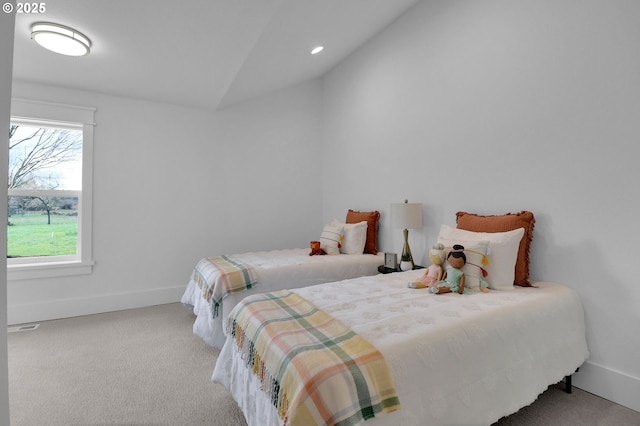 carpeted bedroom featuring baseboards, recessed lighting, lofted ceiling, and visible vents