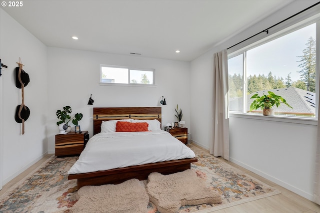 1654 NE Joy Ln, Estacada, OR 97023 - bedroom with multiple windows, light wood-style flooring, recessed lighting, and baseboards