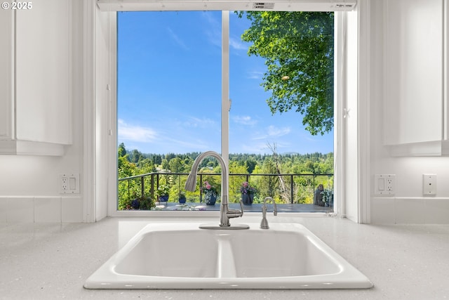 2360 Michael, West Linn, OR 97068 - kitchen view of a sink, white cabinets, and light stone counters