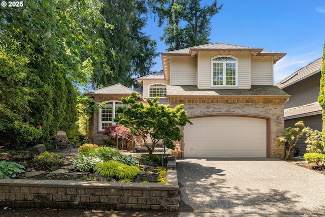 2360 Michael, West Linn, OR 97068 - view of front facade featuring concrete driveway, a garage, brick siding, and roof with shingles
