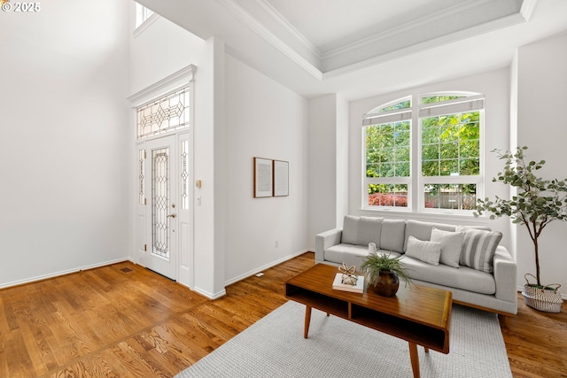 2360 Michael, West Linn, OR 97068 - living room with ornamental molding, plenty of natural light, a tray ceiling, light wood finished floors, and baseboards