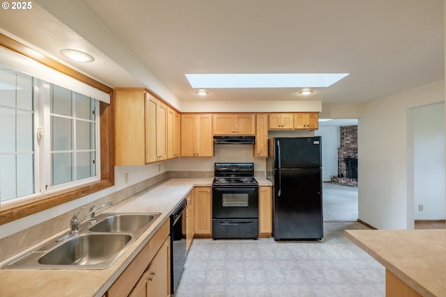 1949 Waln Creek Dr, Salem, OR 97306 - kitchen featuring black appliances, light brown cabinetry, a skylight, a sink, and under cabinet range hood