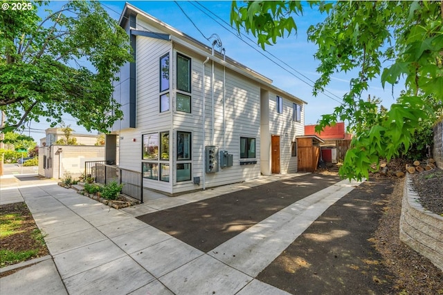 view of side of home with fence