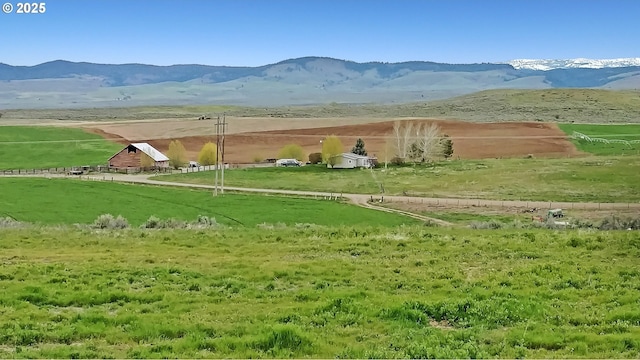 view of mountain feature with a rural view