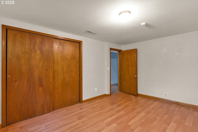 45265 Sunnyside Dr, Foster, OR 97345 - unfurnished bedroom with a closet and light wood-style flooring