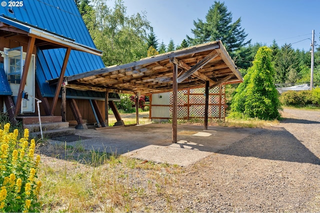 45265 Sunnyside Dr, Foster, OR 97345 - view of parking / parking lot featuring dirt driveway and a detached carport