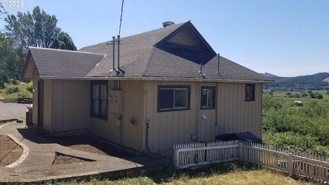 view of side of home featuring a mountain view