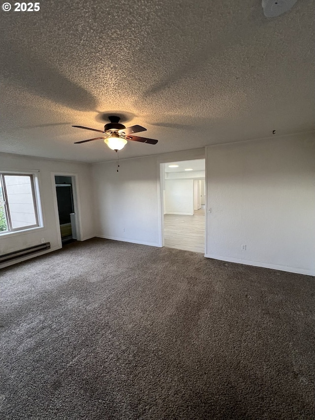 unfurnished room featuring baseboard heating, ceiling fan, carpet flooring, and a textured ceiling