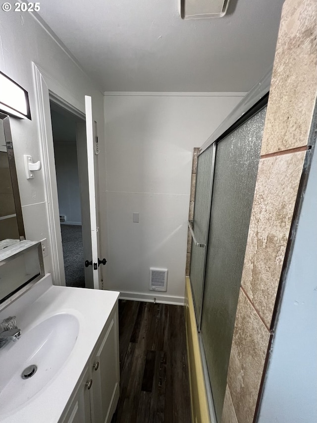 bathroom featuring vanity and wood-type flooring