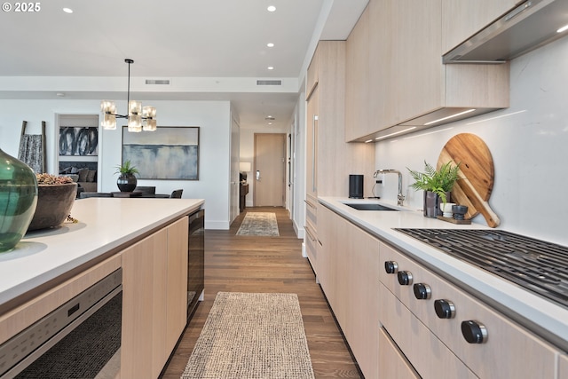550 SW 10th Ave Unit 2306, Portland, OR 97205 - kitchen featuring a sink, light countertops, and modern cabinets