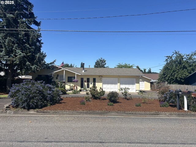 715 N 16th St, Cottage Grove, OR 97424 - ranch-style home featuring an attached garage