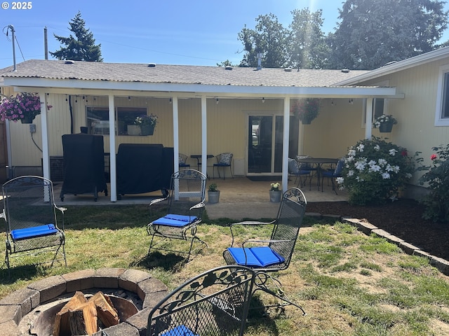 715 N 16th St, Cottage Grove, OR 97424 - back of property with an outdoor fire pit, a patio, and a lawn