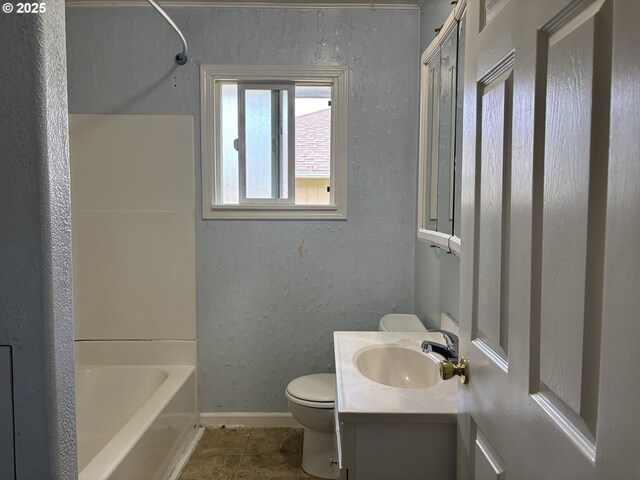 607 Commercial St, North Bend, OR 97459 - full bathroom featuring toilet, vanity, baseboards, a textured wall, and bathing tub / shower combination