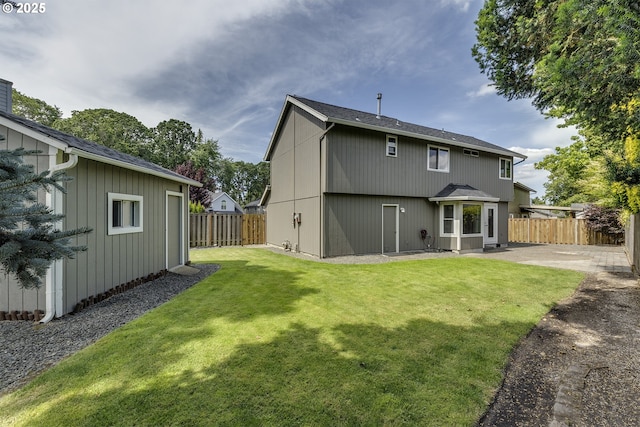 16541 NW Meadow Grass Ct, Beaverton, OR 97006 - back of property featuring a fenced backyard, a patio, and a shingled roof