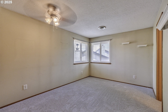 16541 NW Meadow Grass Ct, Beaverton, OR 97006 - empty room featuring ceiling fan, carpet floors, and a textured ceiling