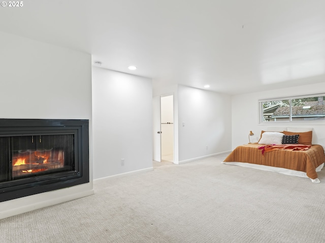 767 NE 152nd Ave, Portland, OR 97230 - bedroom featuring carpet floors, a glass covered fireplace, and recessed lighting