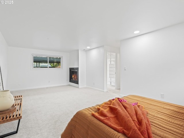 767 NE 152nd Ave, Portland, OR 97230 - bedroom featuring a glass covered fireplace, recessed lighting, and light carpet