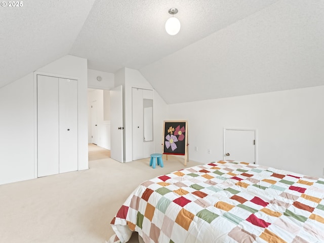 767 NE 152nd Ave, Portland, OR 97230 - bedroom featuring light colored carpet, vaulted ceiling, and a textured ceiling