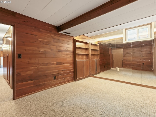 767 NE 152nd Ave, Portland, OR 97230 - empty room with wooden walls, beamed ceiling, and carpet flooring
