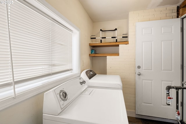 laundry area with washing machine and dryer