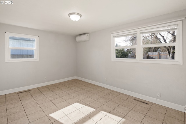 tiled empty room featuring an AC wall unit