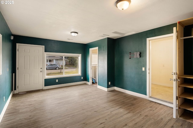 unfurnished bedroom featuring hardwood / wood-style flooring