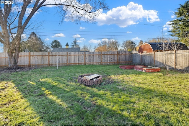 view of yard with an outdoor fire pit