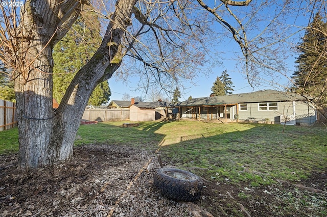 view of yard featuring a storage unit