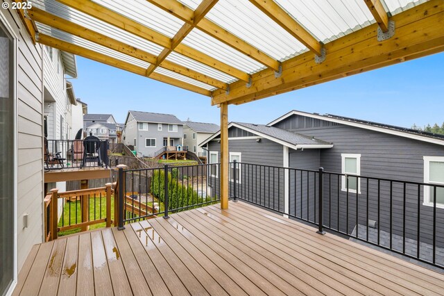 wooden deck featuring a residential view