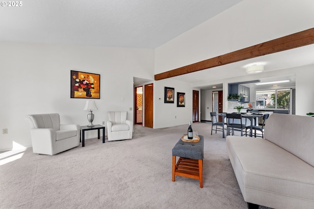 living area featuring high vaulted ceiling and light carpet