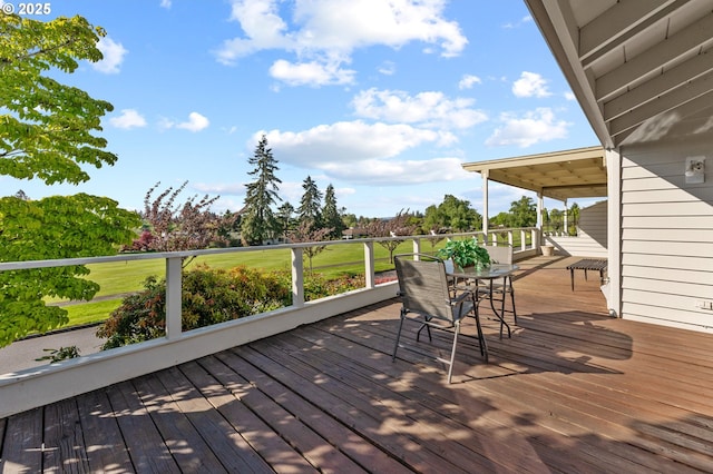 wooden deck with outdoor dining space