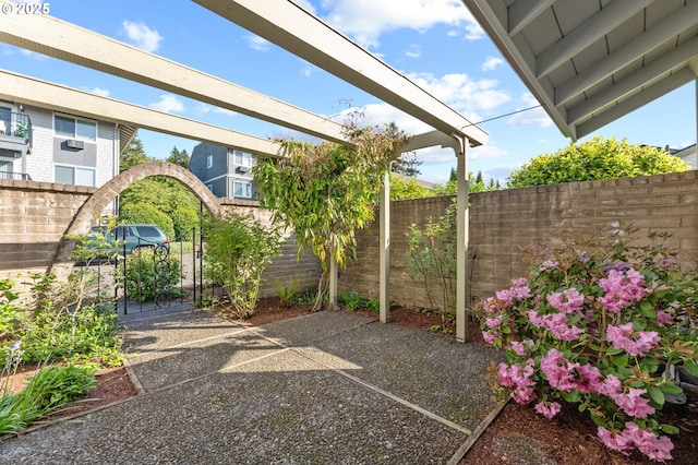 view of patio / terrace featuring fence
