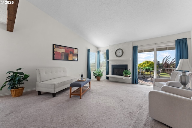 carpeted living room with a brick fireplace, a textured ceiling, baseboards, and lofted ceiling