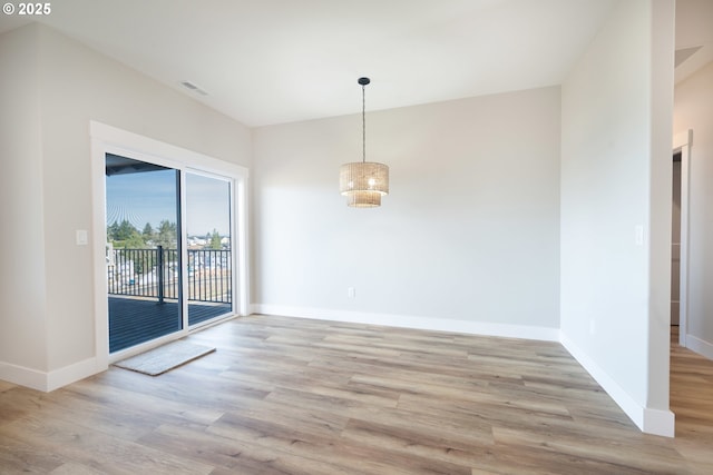 unfurnished dining area with light hardwood / wood-style flooring