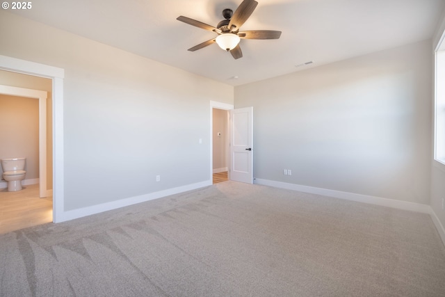 empty room with light carpet and ceiling fan